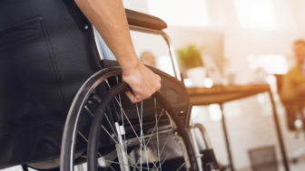 Wheelchair with a hand on it